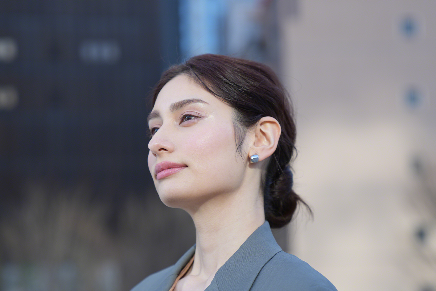 Close up of a person's face against a blurry background
