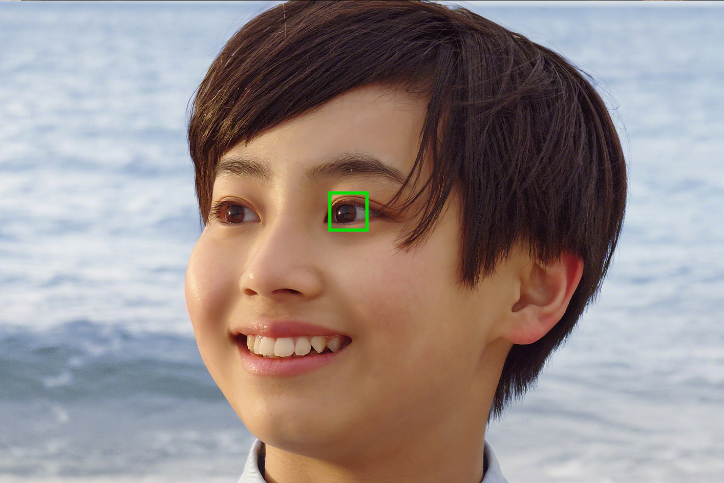 Close up of a person with a green sqaure around their eye